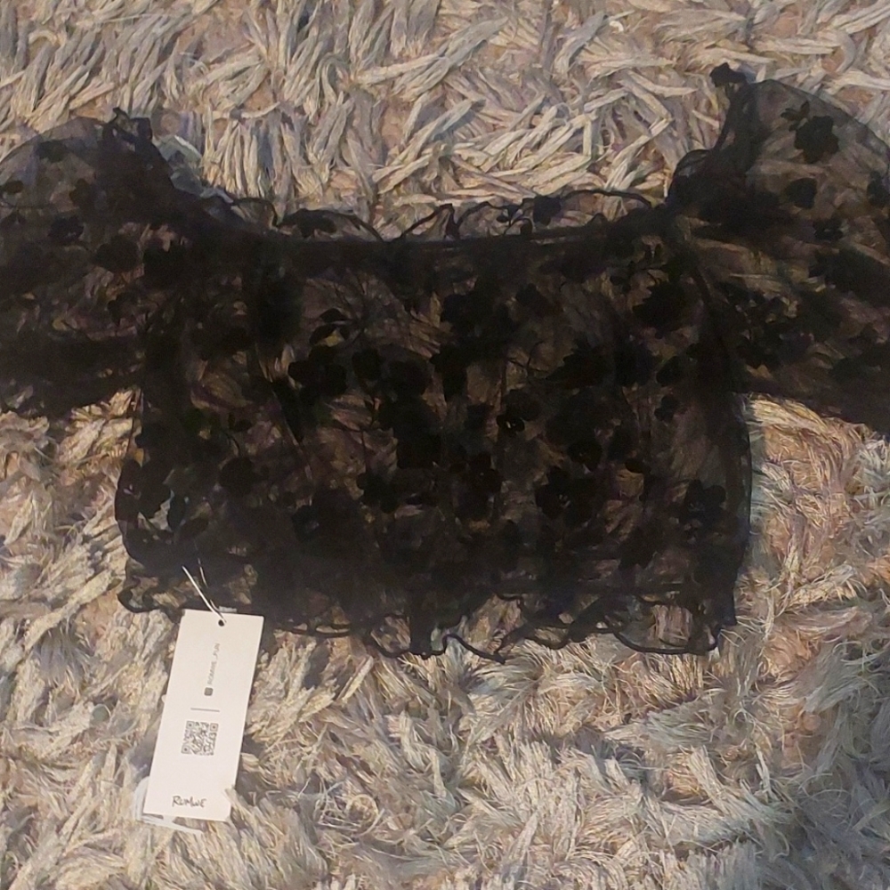 A black mesh flowered crop top